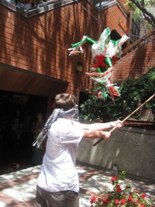 may551 EC San Diego's current youngest student swings at the pinata.