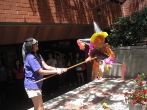 may58 Sang Hee successfully breaks open the pinata.