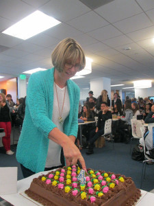 Our Center Director, Cindy Ochoa, with the 4th year anniversary cake!