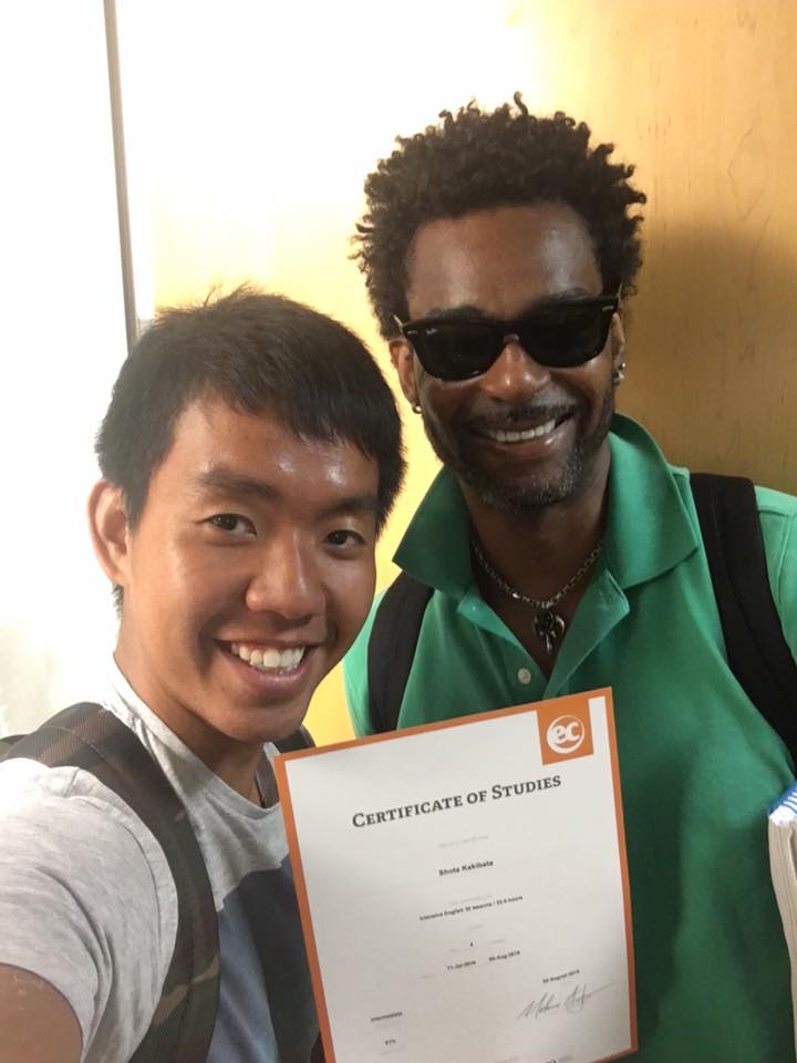 Shota poses with an ECLA teacher